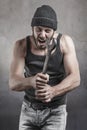 Hooligan shouting a threatening with a wrench Royalty Free Stock Photo