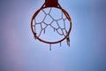 hoop of an orange basketball net with a chain by net and damaged Royalty Free Stock Photo