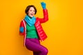 Hooray. Photo of beautiful excited lady raise hands ecstatic mood wear casual red overcoat blue scarf gloves green Royalty Free Stock Photo
