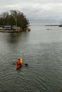 Man rowing a Kayak out of Hoorn harbor, Netherlands.