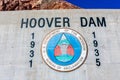 Hoover Dam sign and United States Bureau of Reclamation seal in concrete. Hoover Dam was constructed between 1931 and 1935 on