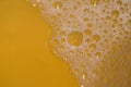 Hop foam looks delicious, and the more beer bubbles, the better the quality of beer. This is a close-up of beer foam.