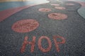 Hop written into rubber floor of playground Royalty Free Stock Photo