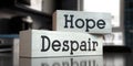 Hope, despair - words on wooden blocks