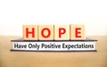 HOPE have only positive expectations symbol. Concept words HOPE have only positive expectations on block on beautiful white