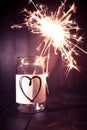 Hope for love, still life with heart jar and burning sparkler Royalty Free Stock Photo