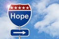 Hope message on red and blue highway sign