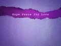 Hope peace joy love text with purple background. Christmas preparation or Advent season concept.