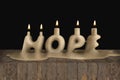 Hope in a shape of candle melting demonstrating lost hope concept. 3D illustration.