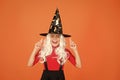 Hope spell works. Little child in witch costume. Halloween party. Small girl in black witch hat. Autumn holiday. Join Royalty Free Stock Photo