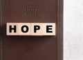 Hope Spelled in Blocks on a Leather Holy Bible