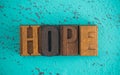 Hope Spelled in Wooden Type Set Block Letters