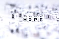 Hope word made from plastic alphabet blocks, stands in white background. Royalty Free Stock Photo