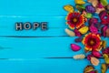 Hope word on blue wood with flower Royalty Free Stock Photo