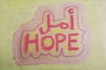 Hope, written in Arabic and English with artistic shapes Royalty Free Stock Photo