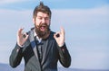 Hopeful and confident about future. Alright gesturing. Man bearded optimistic businessman wear formal suit sky Royalty Free Stock Photo