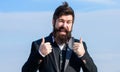Hopeful and confident about future. Thumbs up gesture. Man bearded optimistic businessman wear formal suit sky Royalty Free Stock Photo
