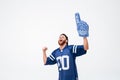 Hopeful excited man fan in blue t-shirt standing isolated Royalty Free Stock Photo