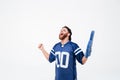 Hopeful excited man fan in blue t-shirt standing isolated Royalty Free Stock Photo