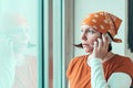 Hopeful female carpenter talking on mobile phone