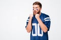 Hopeful male fan in blue t-shirt standing isolated Royalty Free Stock Photo