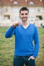 Hopeful men with the key for his home Royalty Free Stock Photo