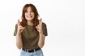 Hopeful smiling girl, cross fingers for good luck, anticipating miracle, waiting for results, wishing to win, standing Royalty Free Stock Photo