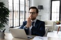 Hopeful young businessman praying God for good luck. Royalty Free Stock Photo