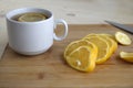 ÃÂ¡hopped lemon and white cup of tea. Royalty Free Stock Photo