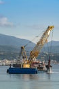 Hopper dredger working in old port of Savona, Italy