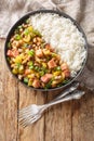 Hoppin John is one of those classic Southern dishes made of black-eyed peas and rice closeup on the plate. Vertical top view Royalty Free Stock Photo