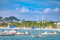 Hopping Tour boats behind Boracay white beach from the water Royalty Free Stock Photo