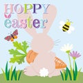Hoppy Easter Bunny with Carrot and Spring Elements Royalty Free Stock Photo