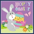 Hoppy Easter Bunny with Decorated Egg and Spring Flowers Royalty Free Stock Photo