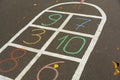 Hopscotch. Cells for game hopscotch drawn with multi-colored chalk on the pavement Royalty Free Stock Photo
