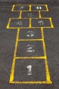 Hopscotch popular street game in schoolyard pavement.