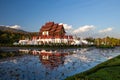 Hor Kham Luang is an elegant Lanna architecture. Reflection in the water in the evening blue sky