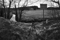 Hora Svateho Sebestiana, Czech republic - April 27, 2020: camera and stativ bei Cerna creek between czech and german landscape in