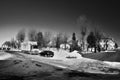 Hora Svateho Sebestiana, Czech republic - February 25, 2018: cars on snowy square in winter Ore mountains with dream black and whi