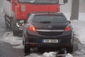 Hora Svateho Sebestiana, Czech republic - November 25, 2018: car and camion in centre of village in winter foggy Ore mountains