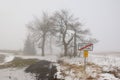 Hora Svateho Sebestiana, Czech republic - November 25, 2018: traffic sign on end of village in winter foggy Ore mountains