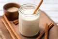 horchata in a glass jar with a striped straw