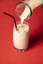 Horchata in a glass. Pouring Mexican cocktail. Summer cold drink Royalty Free Stock Photo