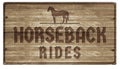 Horesback Rides Sign Wood Carved Royalty Free Stock Photo