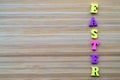 Horiontal inscription Easter made from small wooden color letters