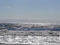 Horizon Coast ocean waves trees beach rocks water sand sky Washington Royalty Free Stock Photo