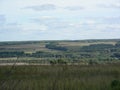 The horizon is covered with vegetation along the hills