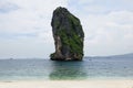 Horizon view of a big high rock cliff filled with green vegetation. Royalty Free Stock Photo