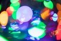 Horizontal abstract bokeh background of evening party circle festive lights in red, yellow, blue, violet, orange round Royalty Free Stock Photo