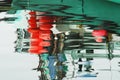 Abstract water reflection of green and red boat with white sky Royalty Free Stock Photo